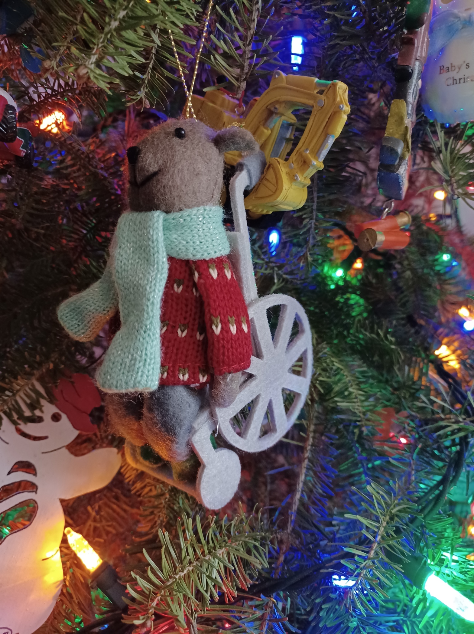 Christmas ornament mouse in a wheelchair